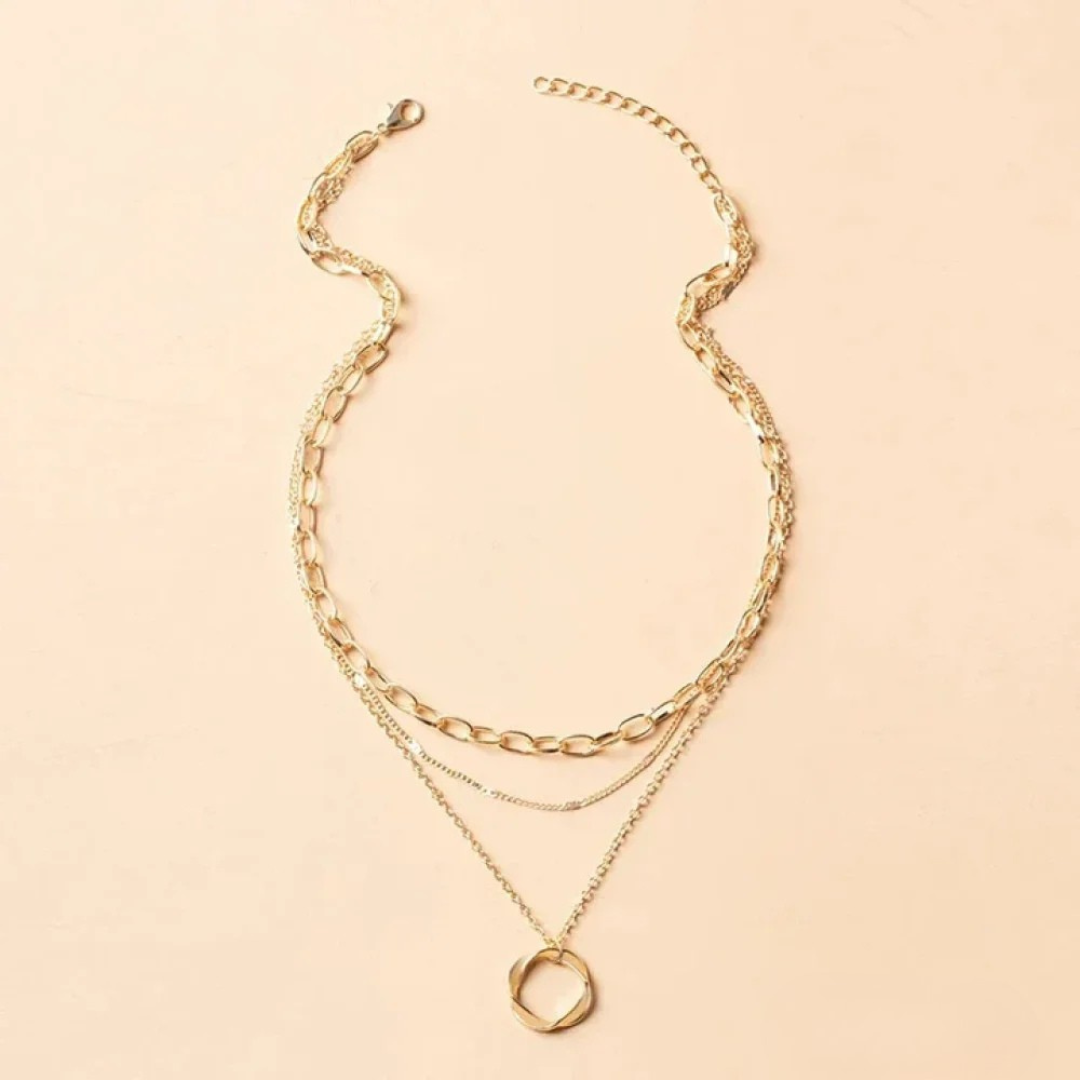 Gold necklace with chain and pendant in vintage style